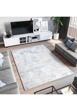 Krémovo-modrý koberec s abstraktným vzorom